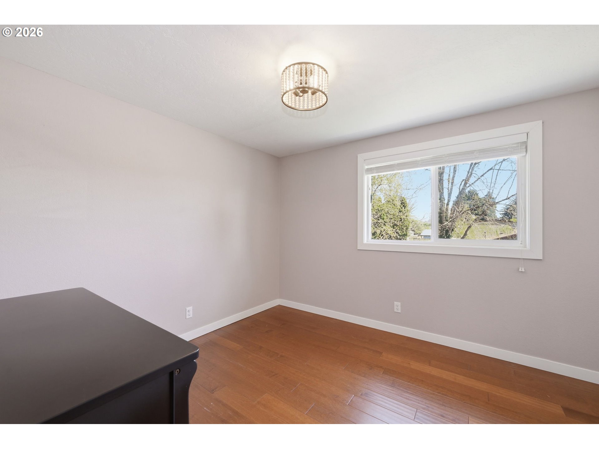 2612 Sage Street Eugene, OR 97404 - Photo 25 of 45 an empty room with wooden floor and a window