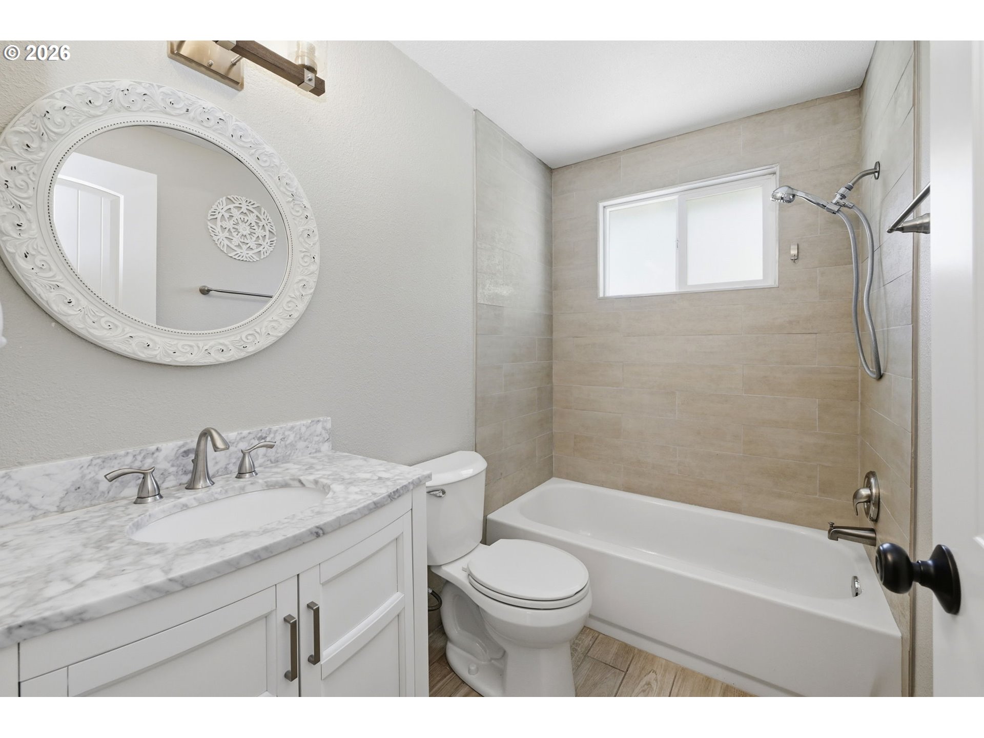 2612 Sage Street Eugene, OR 97404 - Photo 29 of 45 a bathroom with a granite countertop toilet sink and mirror