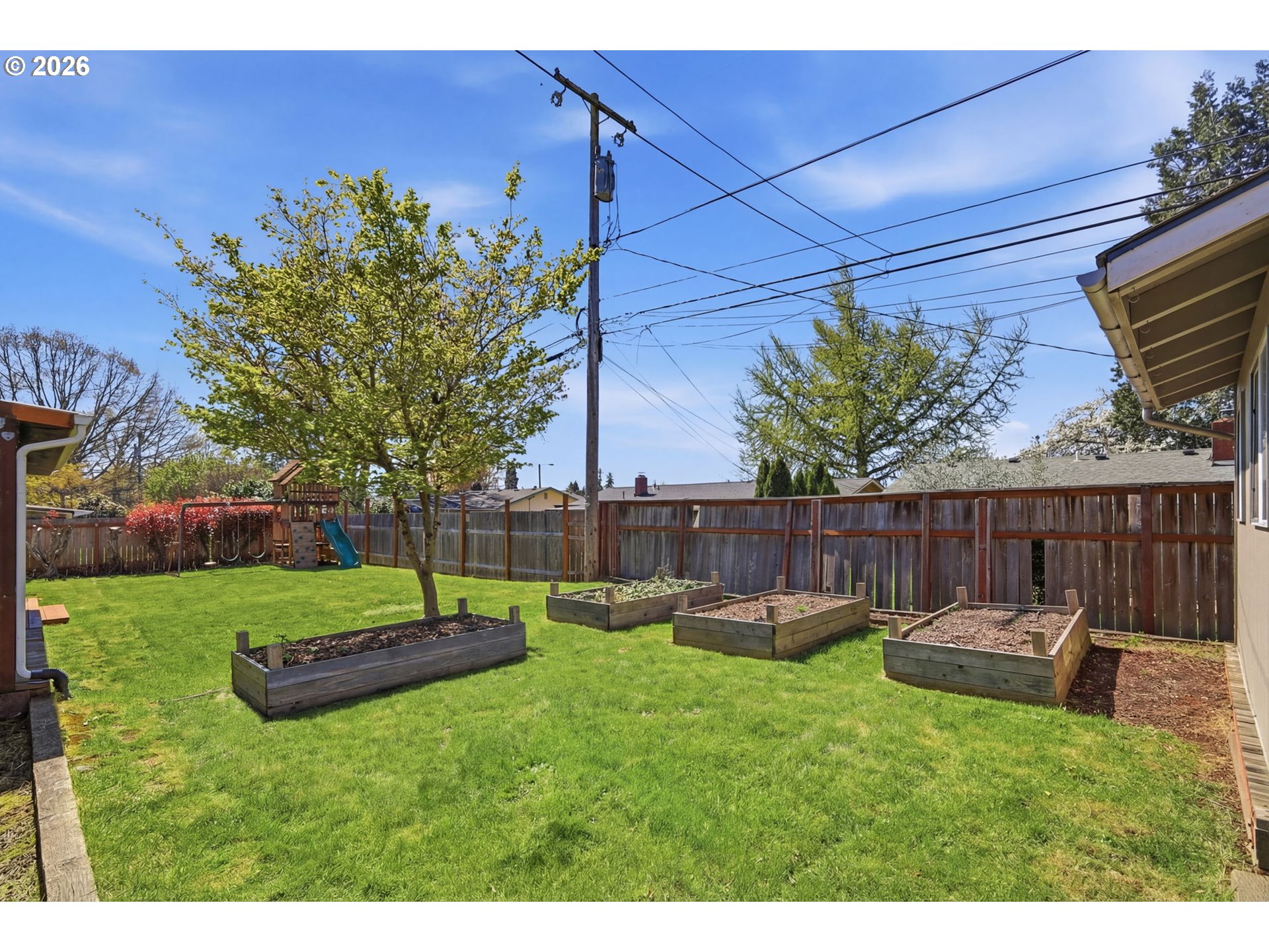 2612 Sage Street Eugene, OR 97404 - Photo 35 of 45 a backyard of a house with lots of green space