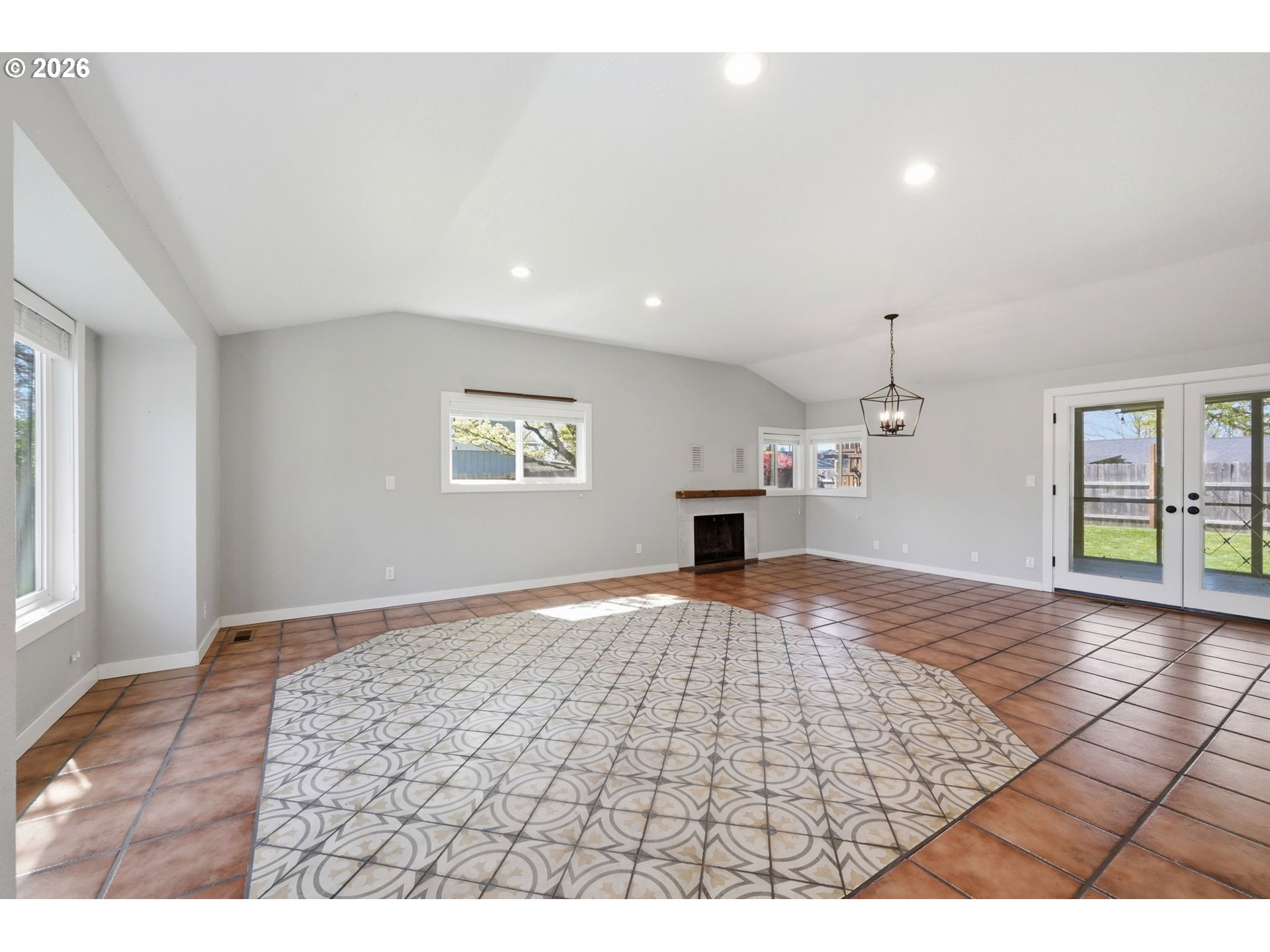 2612 Sage Street Eugene, OR 97404 - Photo 5 of 45 a view of an empty room with window and wooden floor