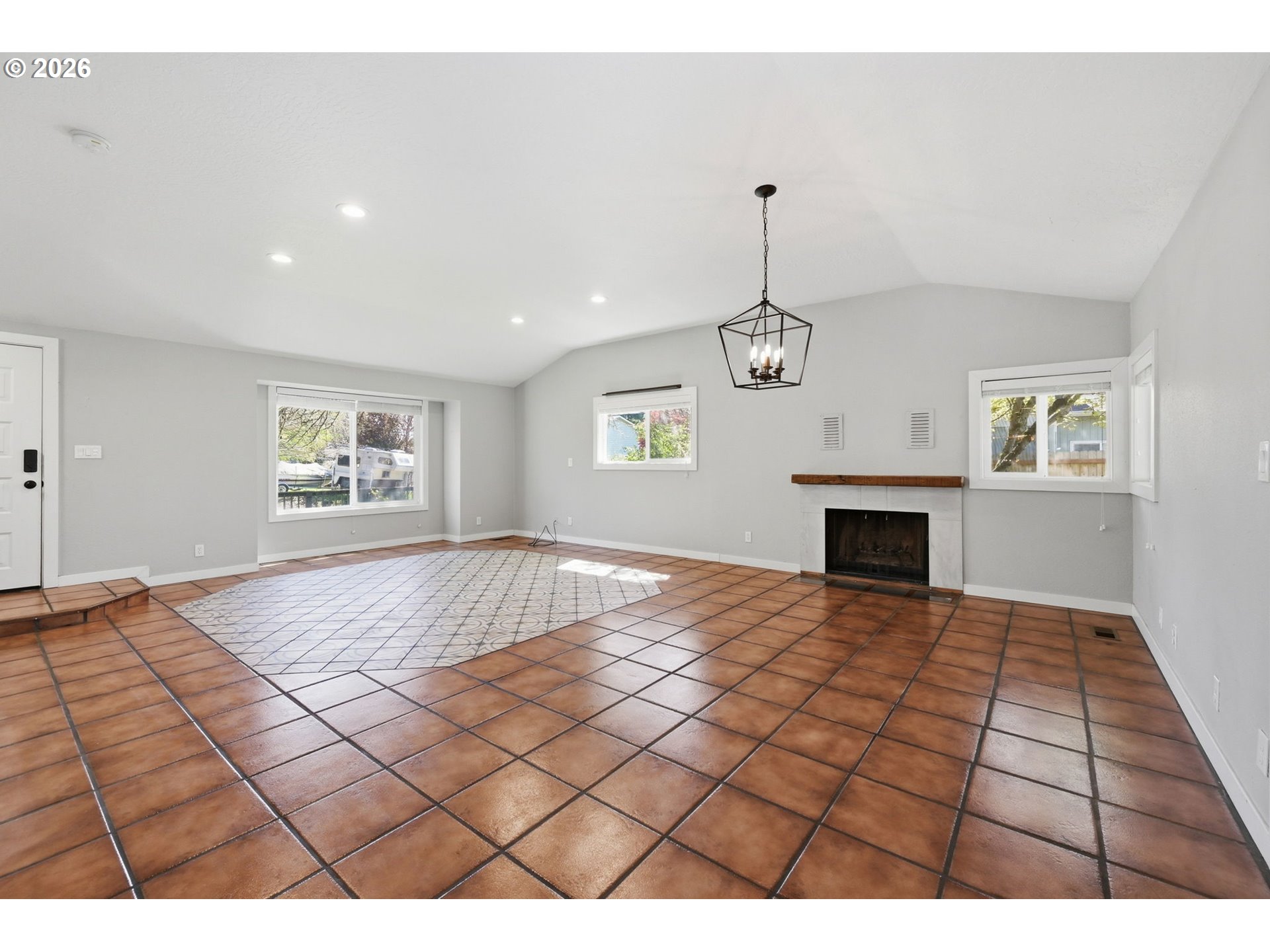 2612 Sage Street Eugene, OR 97404 - Photo 9 of 45 a view of an empty room with window and fireplace