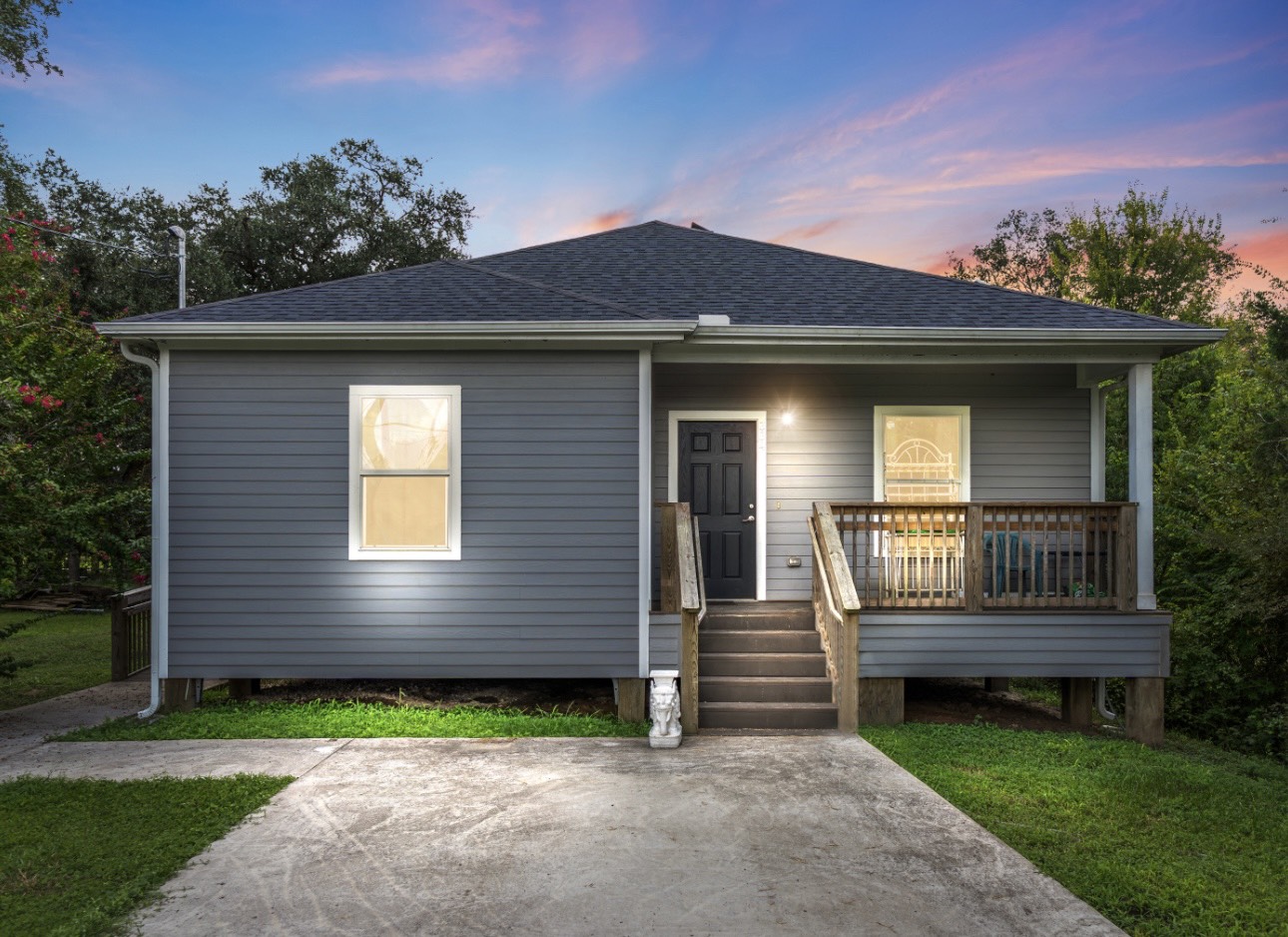 a front view of a house with garden