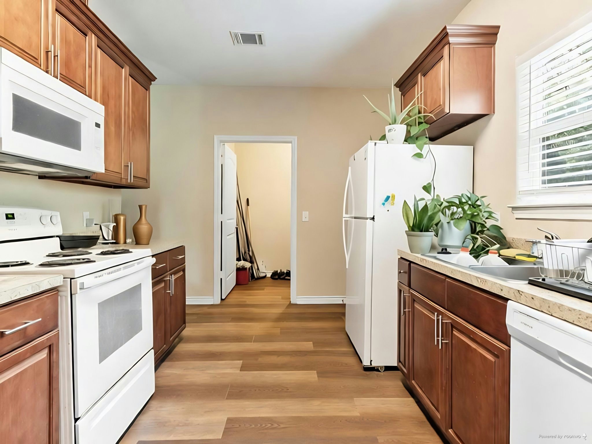 334 Old River Road North Palacios, TX 77465 - Photo 11 of 15 a kitchen with stainless steel appliances granite countertop a stove a sink and a refrigerator