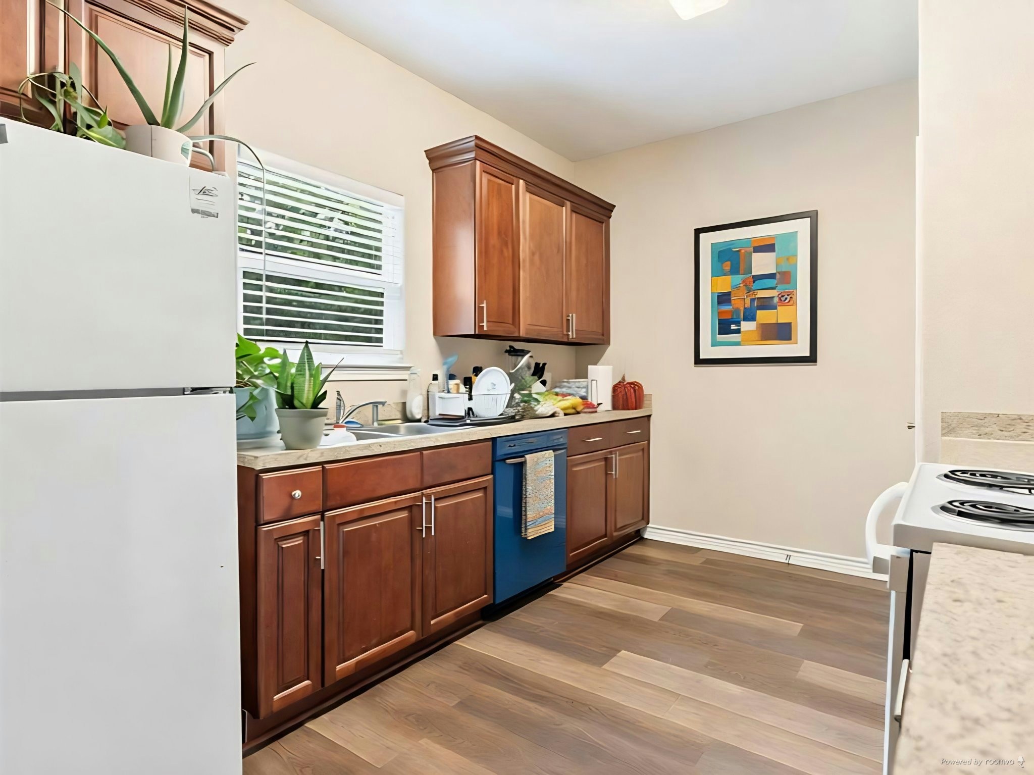 334 Old River Road North Palacios, TX 77465 - Photo 10 of 15 a kitchen with stainless steel appliances granite countertop a stove a sink and a microwave