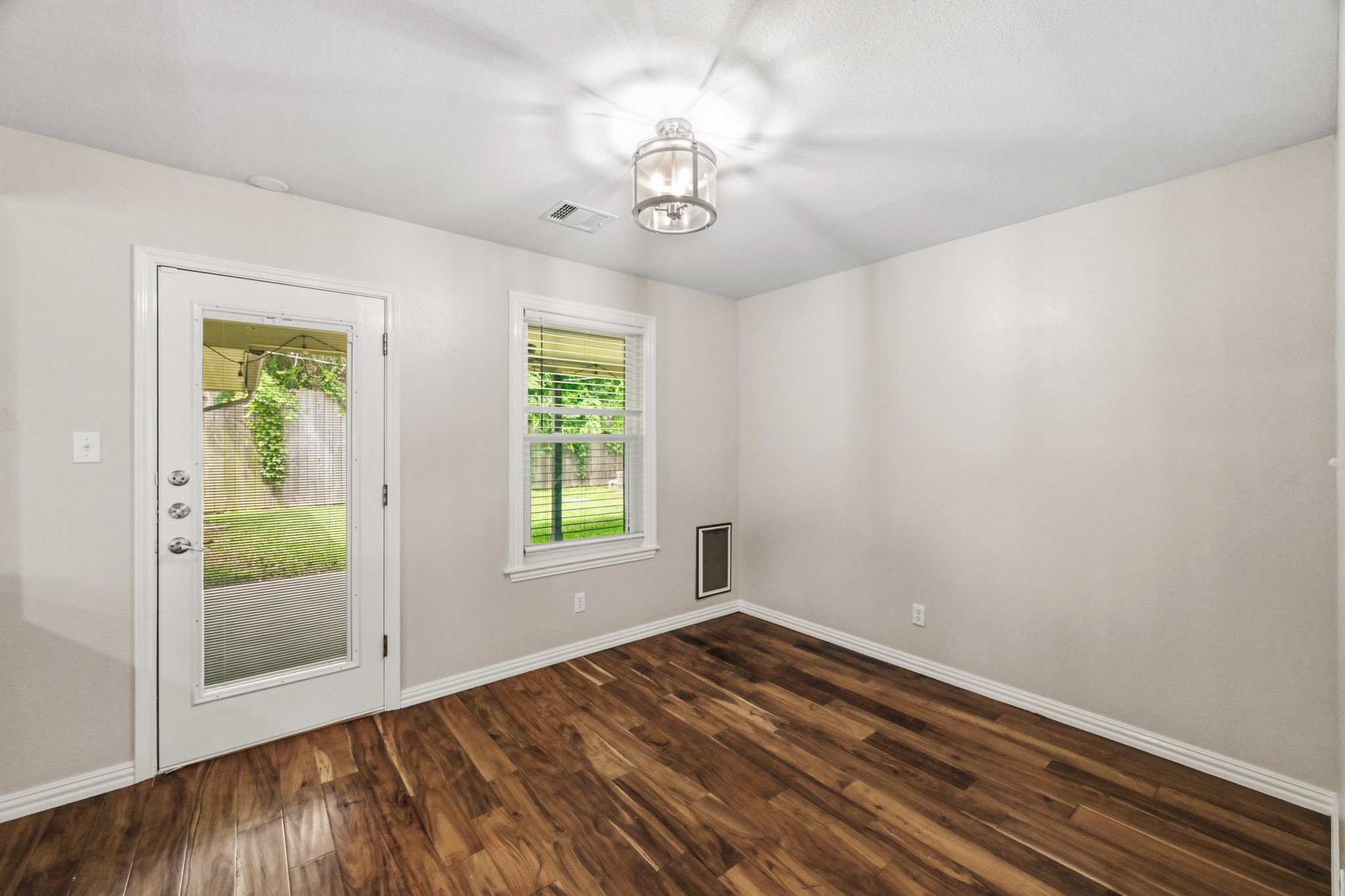3602 Sweet Gum Spring, TX 77388 - Photo 7 of 30 wooden floor in an empty room with a window