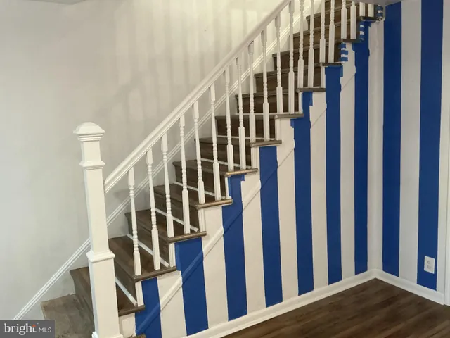 a view of entryway with wooden floor