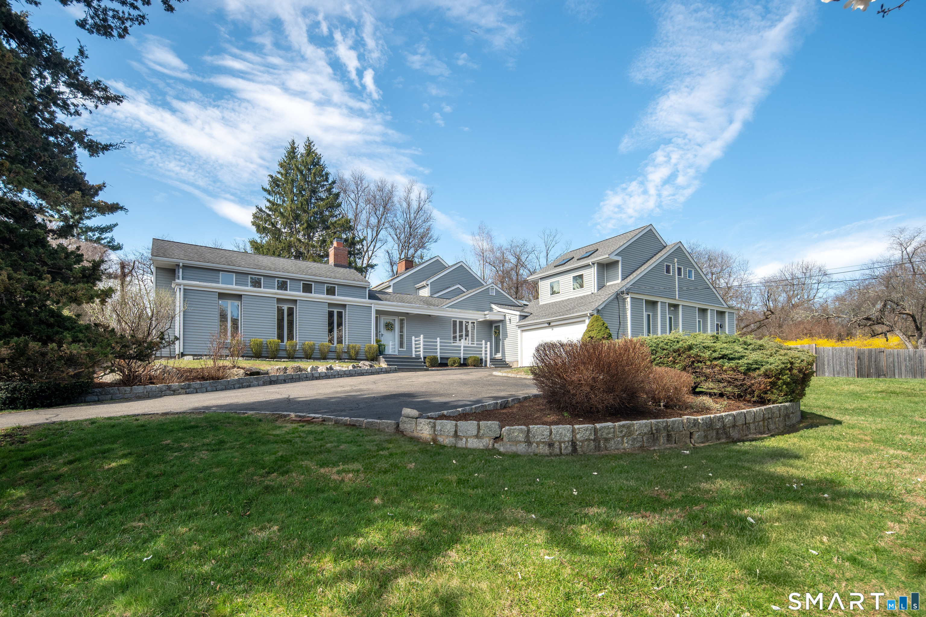 79 Warncke Road Wilton, CT 06897 - Photo 1 of 1 a front view of a house with a garden