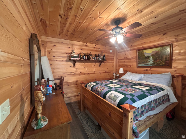 19075 West Honesty Cove Duchesne, UT 84021 - Photo 11 of 44 Room featuring extensive wood-paneled walls and a matching wood-paneled ceiling