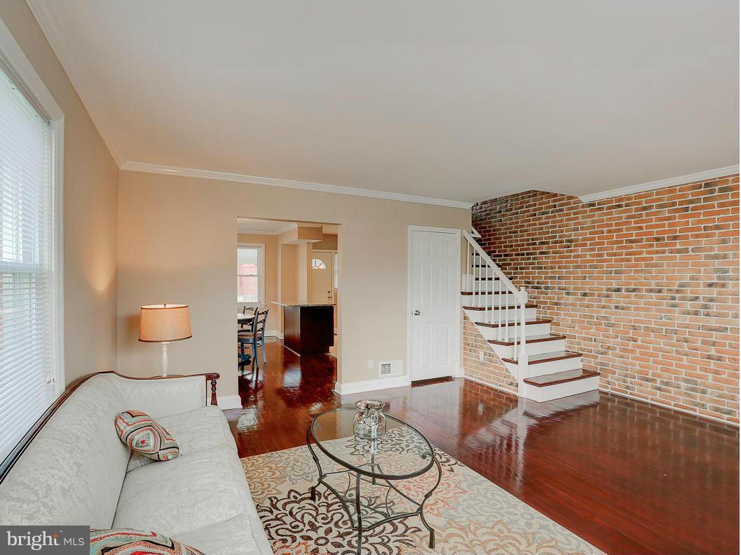 51 Hawthorne Road Middle River, MD 21220 - Photo 1 of 30 a living room with furniture and wooden floor