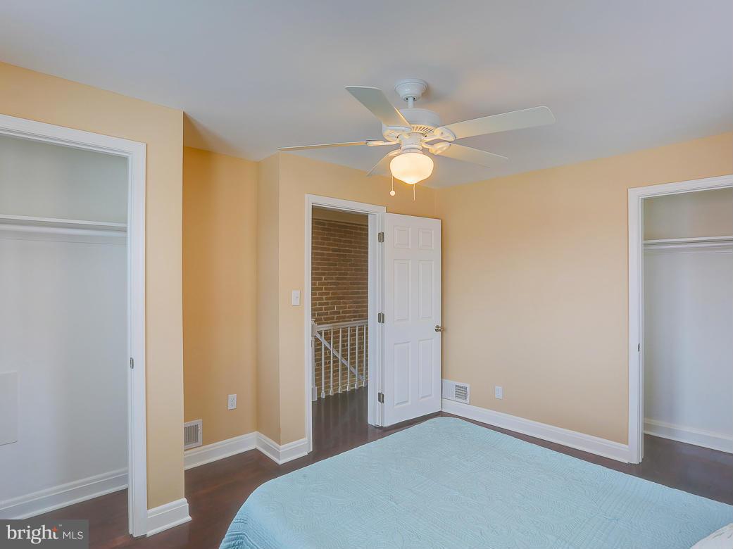 51 Hawthorne Road Middle River, MD 21220 - Photo 11 of 30 a bedroom with a bed and a chandelier