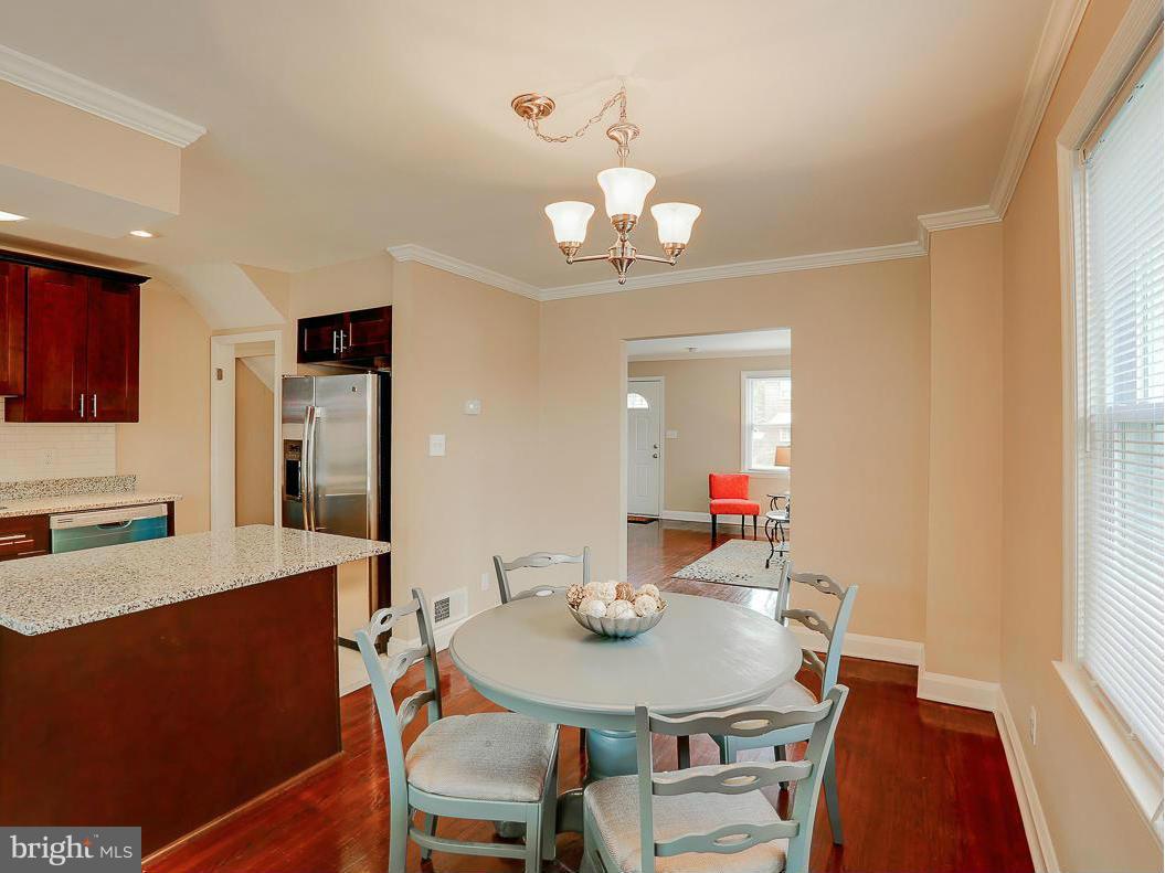 51 Hawthorne Road Middle River, MD 21220 - Photo 17 of 30 a view of a dining room with furniture and wooden floor