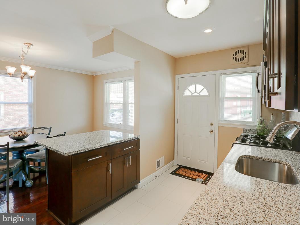 51 Hawthorne Road Middle River, MD 21220 - Photo 5 of 30 a kitchen with a sink stove and cabinets