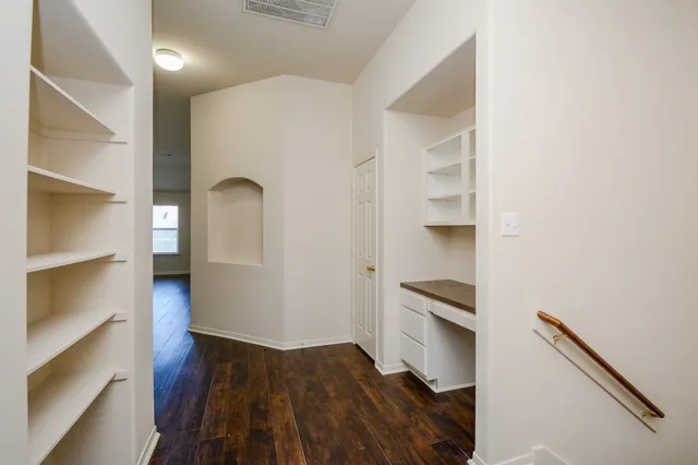 a kitchen with a refrigerator and a stove