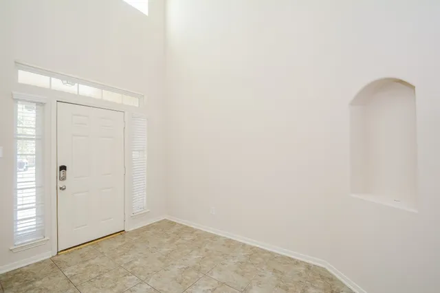 an empty room with windows