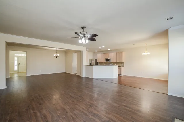 a view of a kitchen with a sink and a window