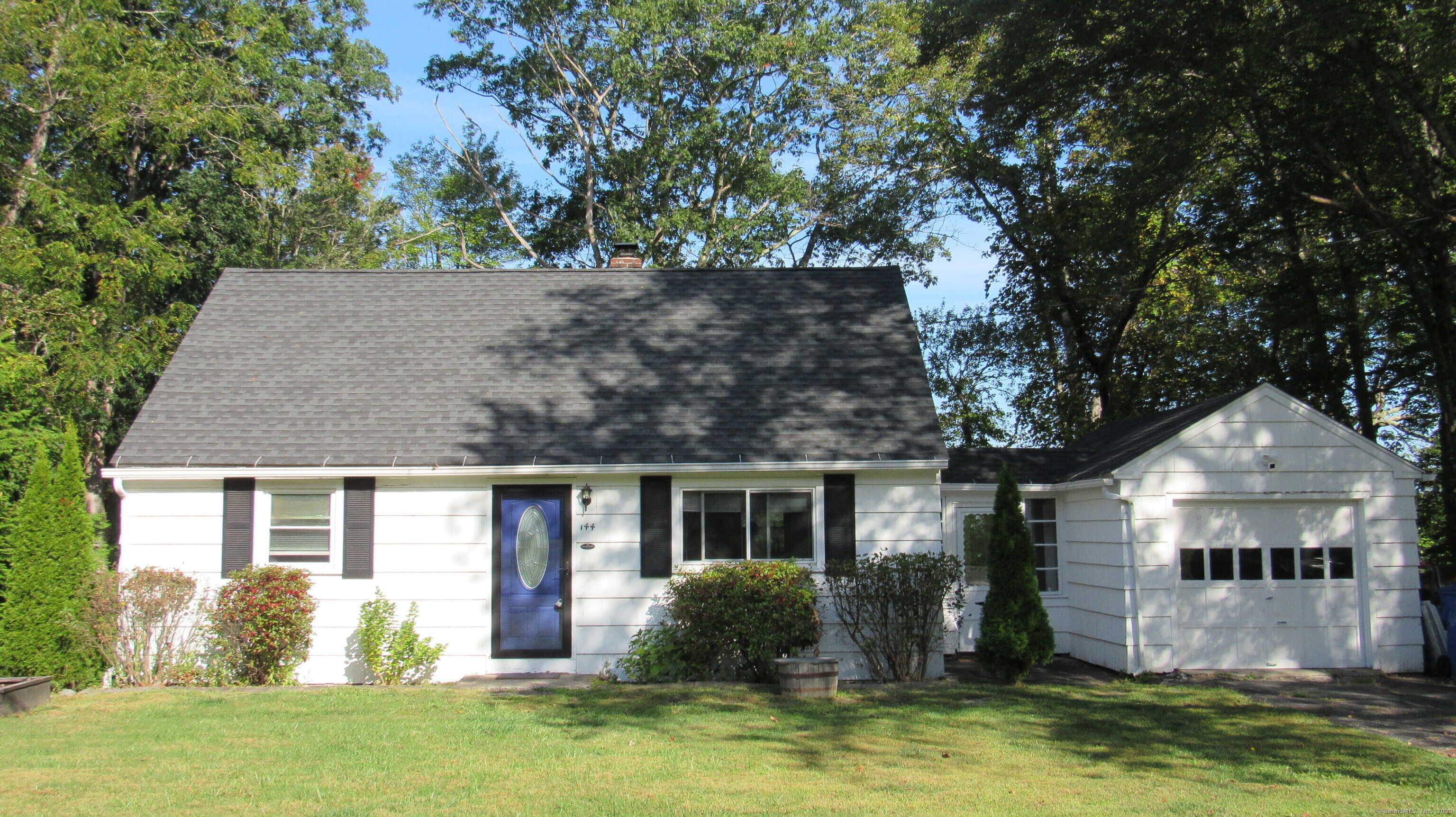 front view of a house with a yard