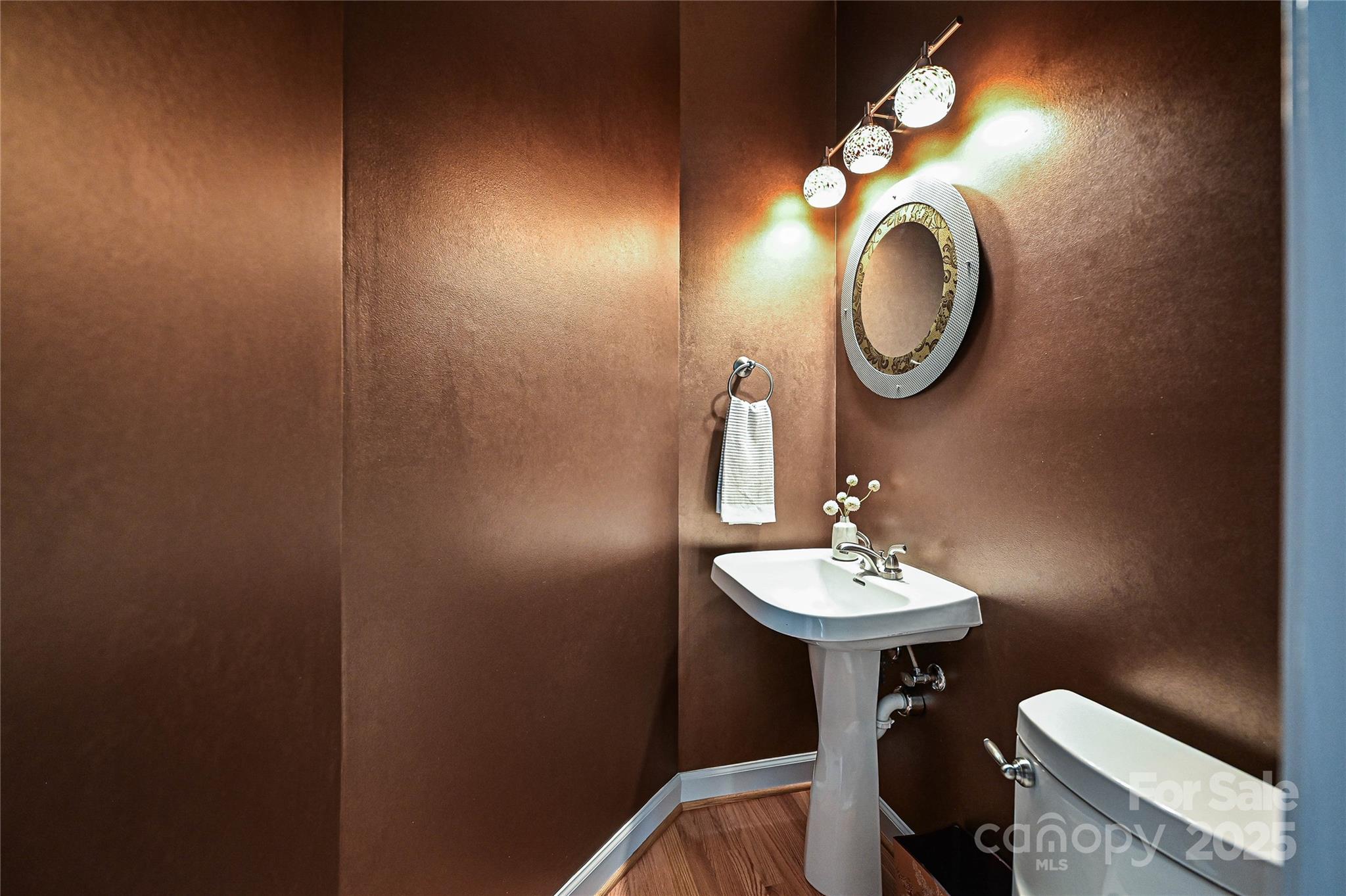 333 West 7th Street Charlotte, NC 28202 - Photo 14 of 46 a bathroom with a sink and a mirror