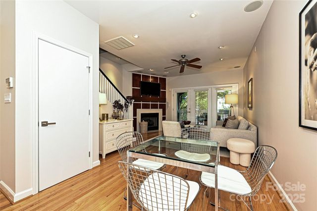 a view of a livingroom with furniture and staircase