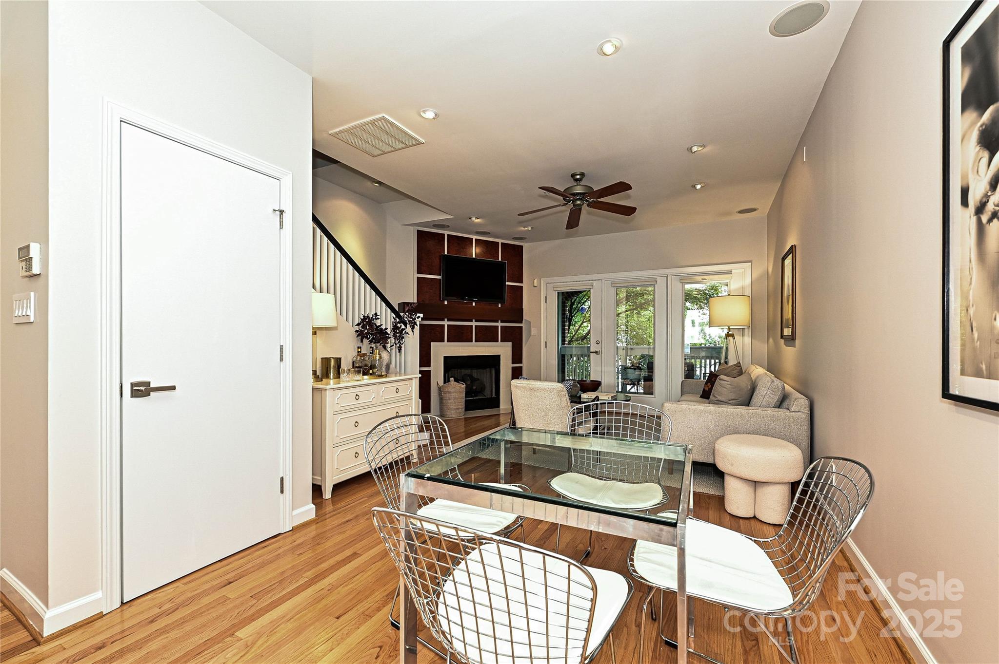 333 West 7th Street Charlotte, NC 28202 - Photo 16 of 46 a living room with furniture a fireplace and a large window