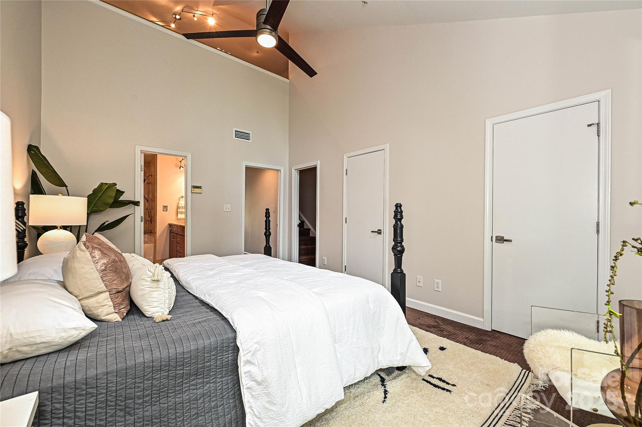 333 West 7th Street Charlotte, NC 28202 - Photo 26 of 46 a bedroom with a bed and wooden floor