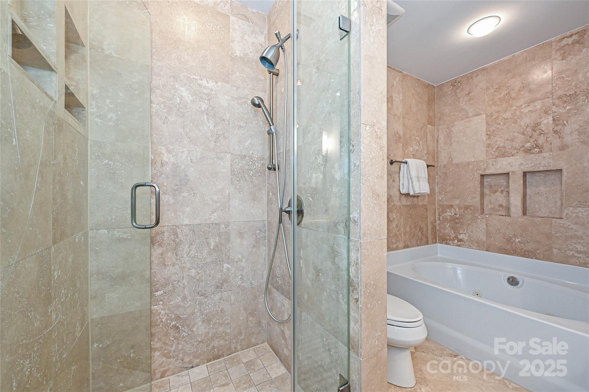 333 West 7th Street Charlotte, NC 28202 - Photo 31 of 46 a bathroom with a shower and a toilet