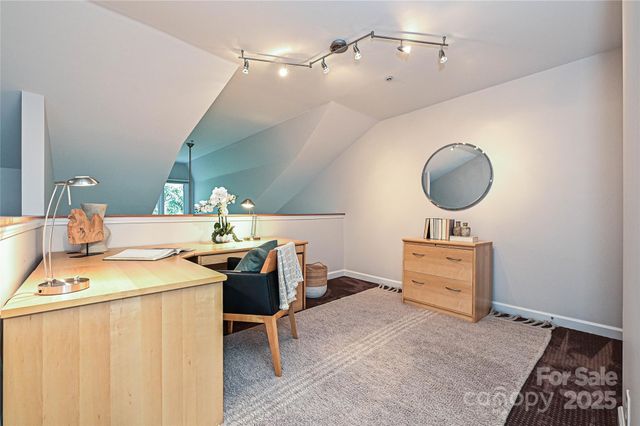 a room with a table and chairs