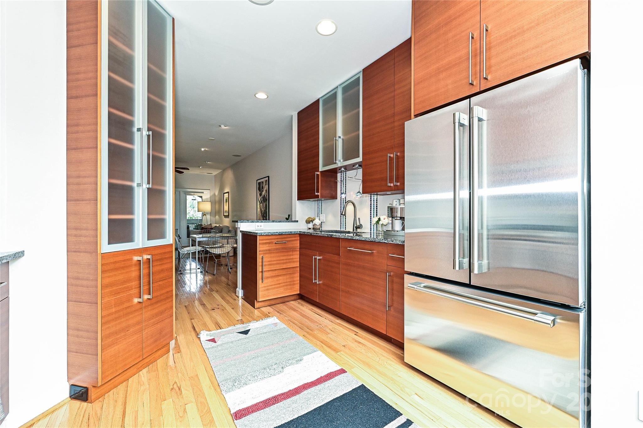 333 West 7th Street Charlotte, NC 28202 - Photo 10 of 46 a kitchen with stainless steel appliances granite countertop a refrigerator and a sink