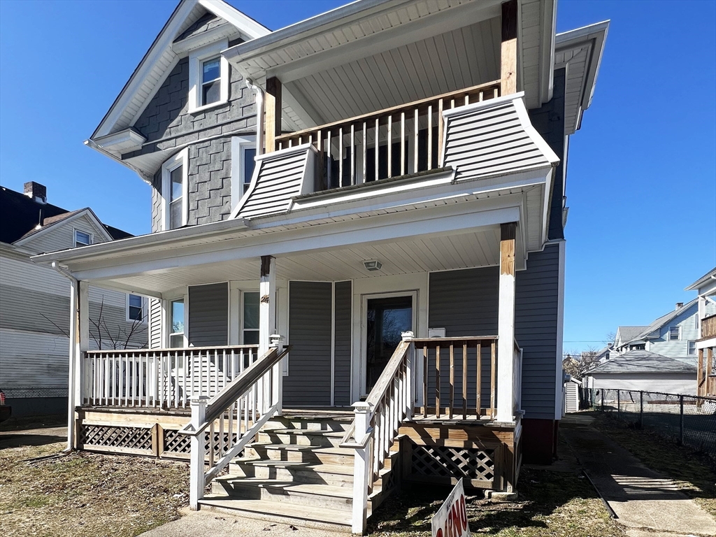 24 Wareham Street Springfield, MA 01108 - Photo 1 of 16 front view of a house with a deck