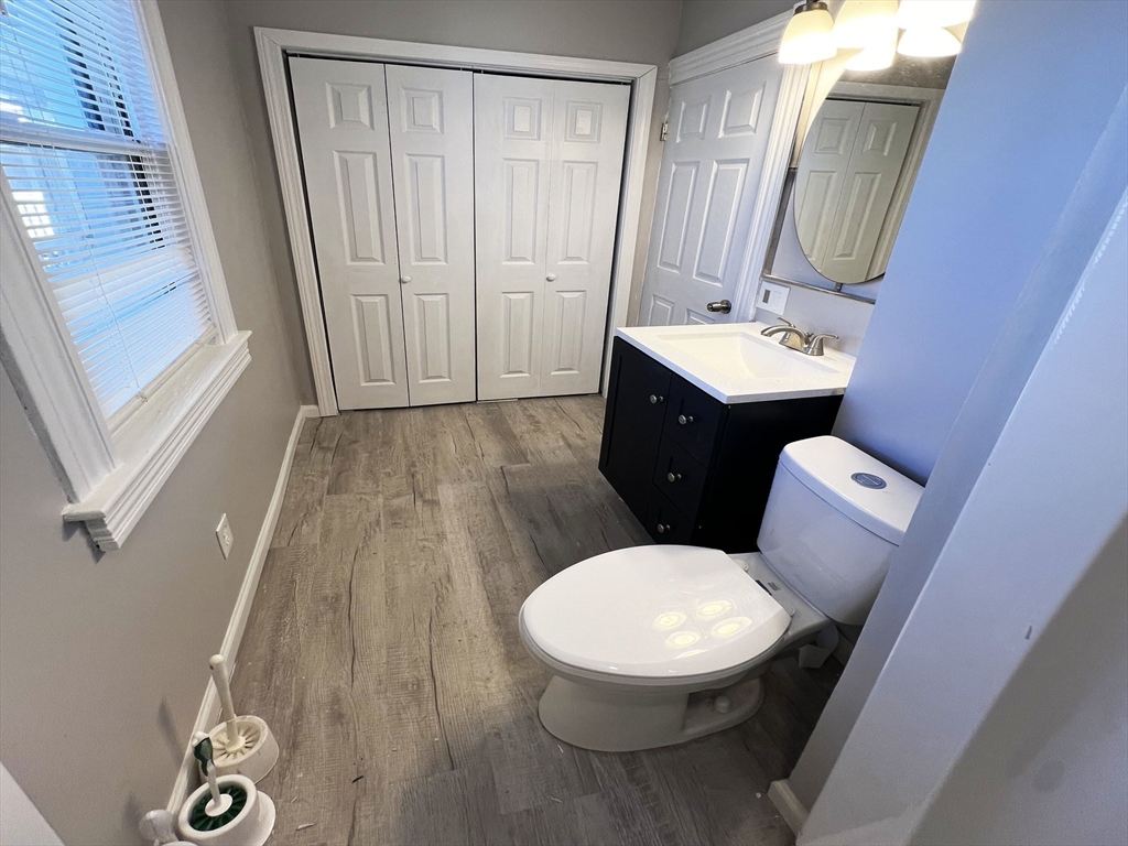 24 Wareham Street Springfield, MA 01108 - Photo 11 of 16 a bathroom with a toilet sink and mirror