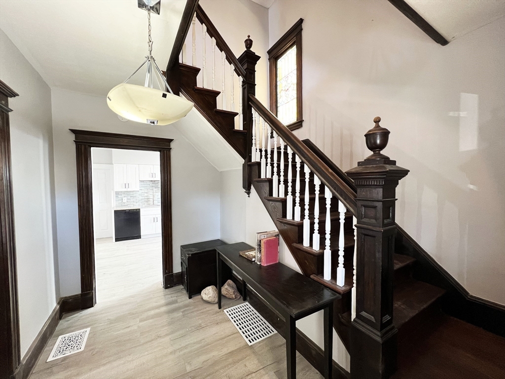 24 Wareham Street Springfield, MA 01108 - Photo 2 of 16 a view of entryway and hall with wooden floor