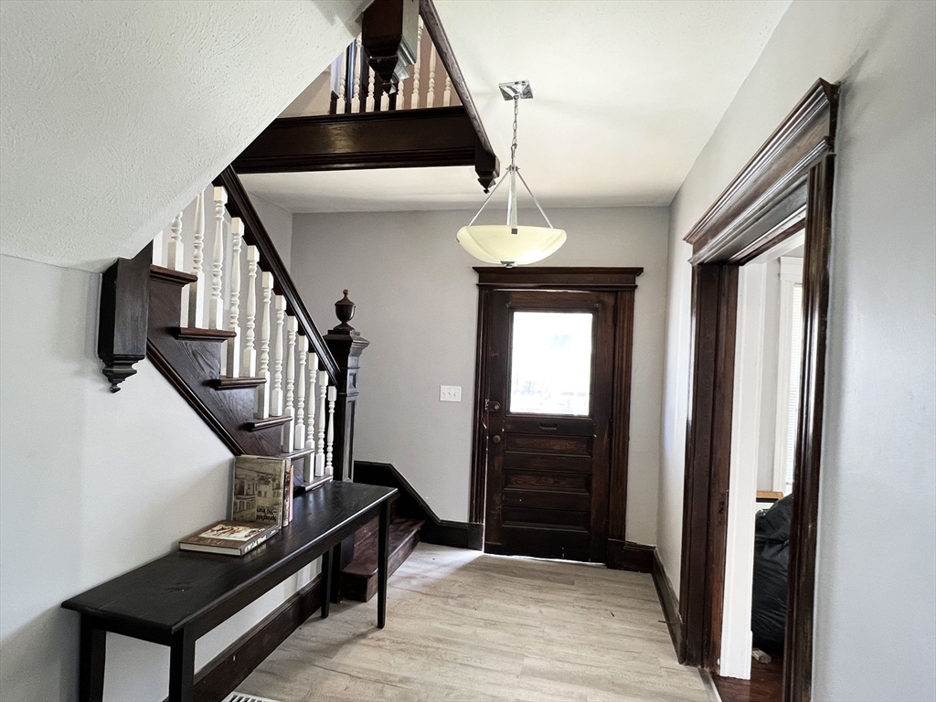 24 Wareham Street Springfield, MA 01108 - Photo 3 of 16 a view of entryway and hall with wooden floor