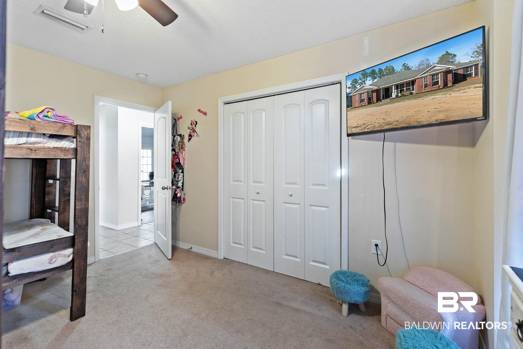 55750 Lottie Road Perdido, AL 36562 - Photo 43 of 84 Bedroom with light carpet, a closet, a ceiling fan, and a textured ceiling
