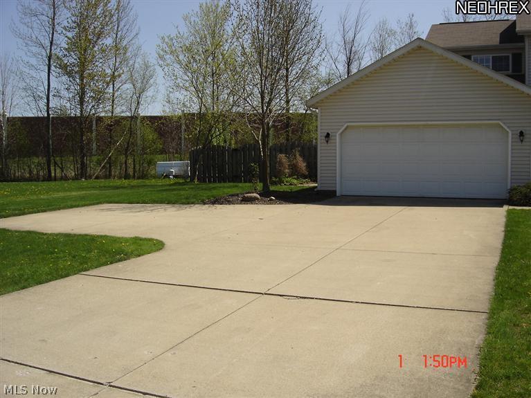 7525 Reynolds Road Mentor, OH 44060 - Photo 22 of 23 2.5 garage -double turn around and extra wide concrete driveway.