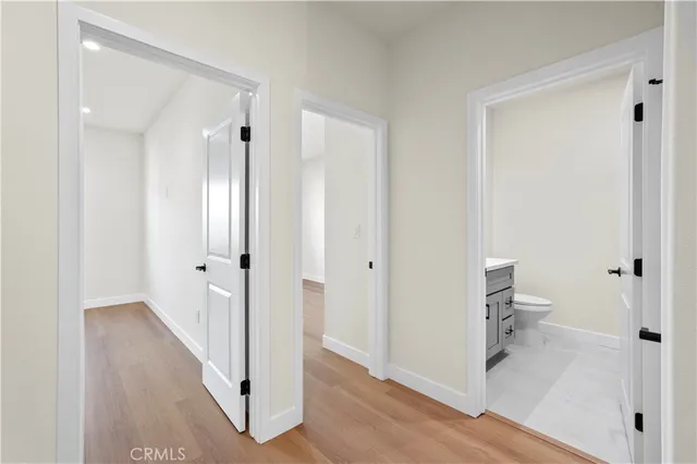 a view of a bathroom from a hallway