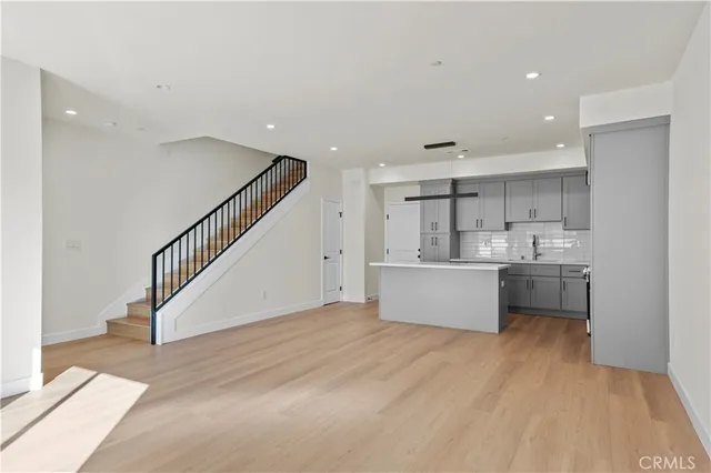 a view of kitchen with counter top space and stainless steel appliances