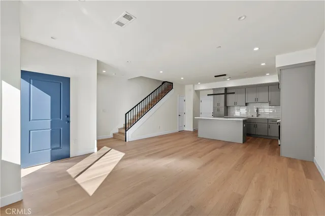 a view of a kitchen with sink and cabinet