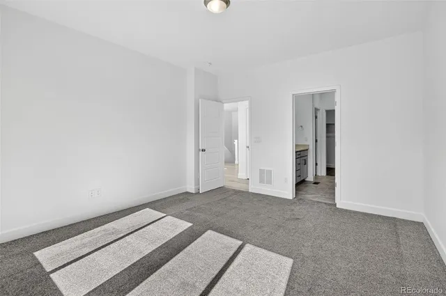 a bathroom with a granite countertop sink mirror and double