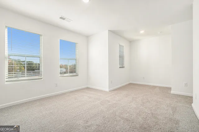 an empty room with windows