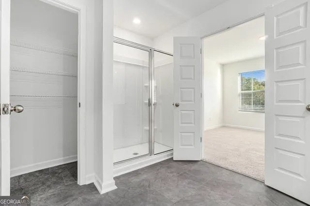 a view of an empty room with a window