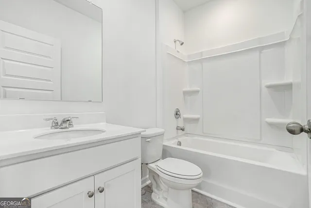 a bathroom with a sink a toilet and a bathtub