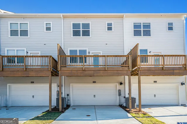 a view of a house with wooden floor and a large window