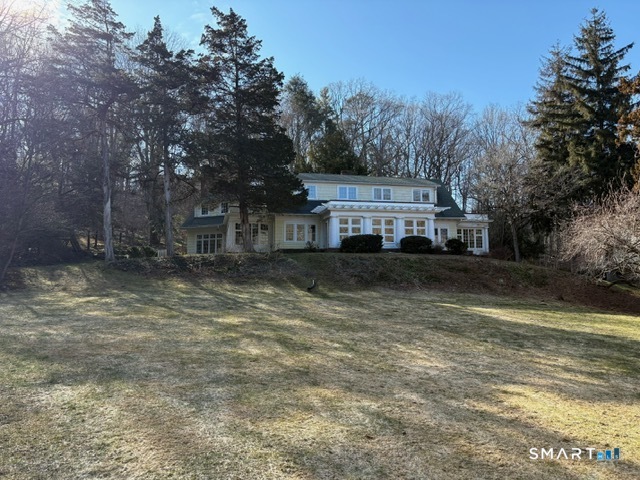 1050 Whitney Avenue Hamden, CT 06517 - Photo 1 of 40 a view of a house with a yard
