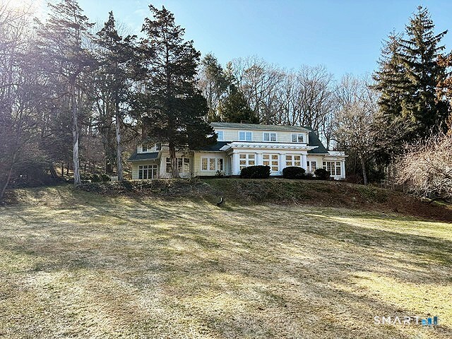 1050 Whitney Avenue Hamden, CT 06517 - Photo 2 of 40 a view of a house with a yard