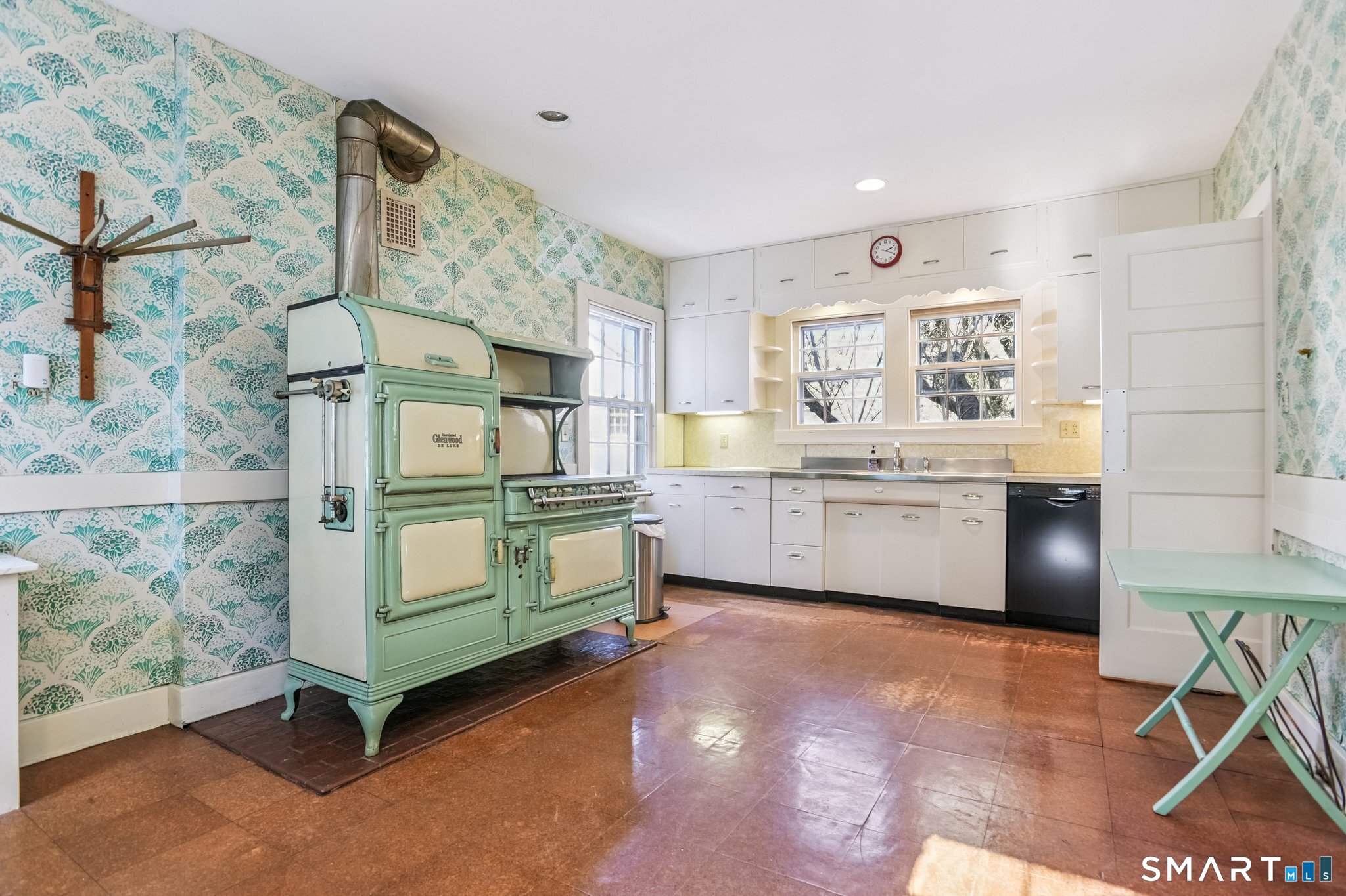 1050 Whitney Avenue Hamden, CT 06517 - Photo 21 of 40 a kitchen with cabinets a sink and appliances