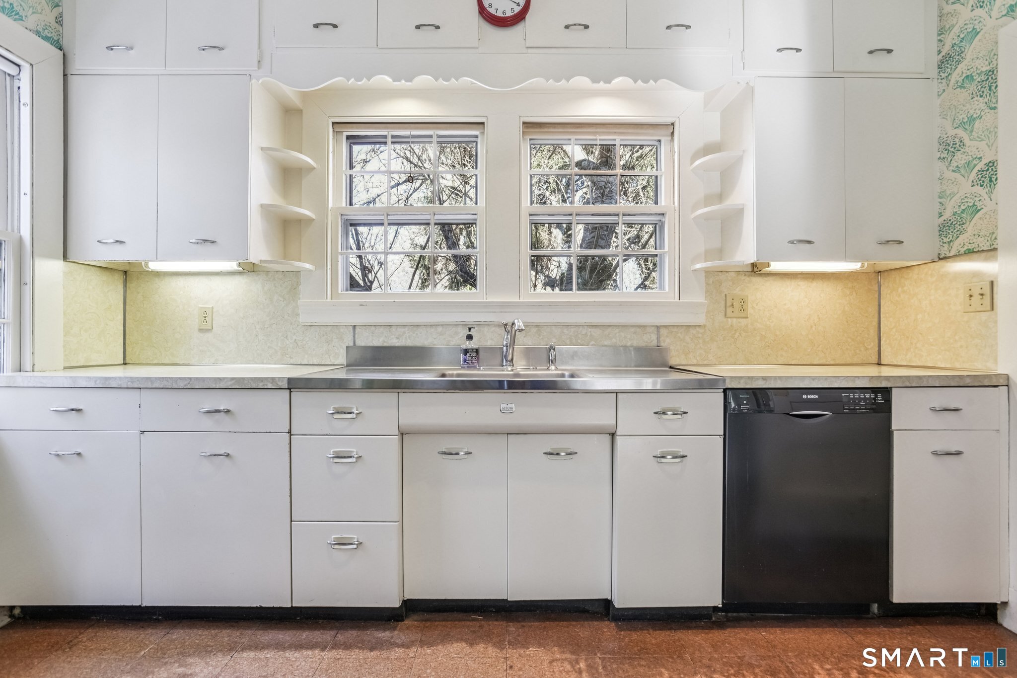 1050 Whitney Avenue Hamden, CT 06517 - Photo 23 of 40 a kitchen with granite countertop a sink window and cabinets