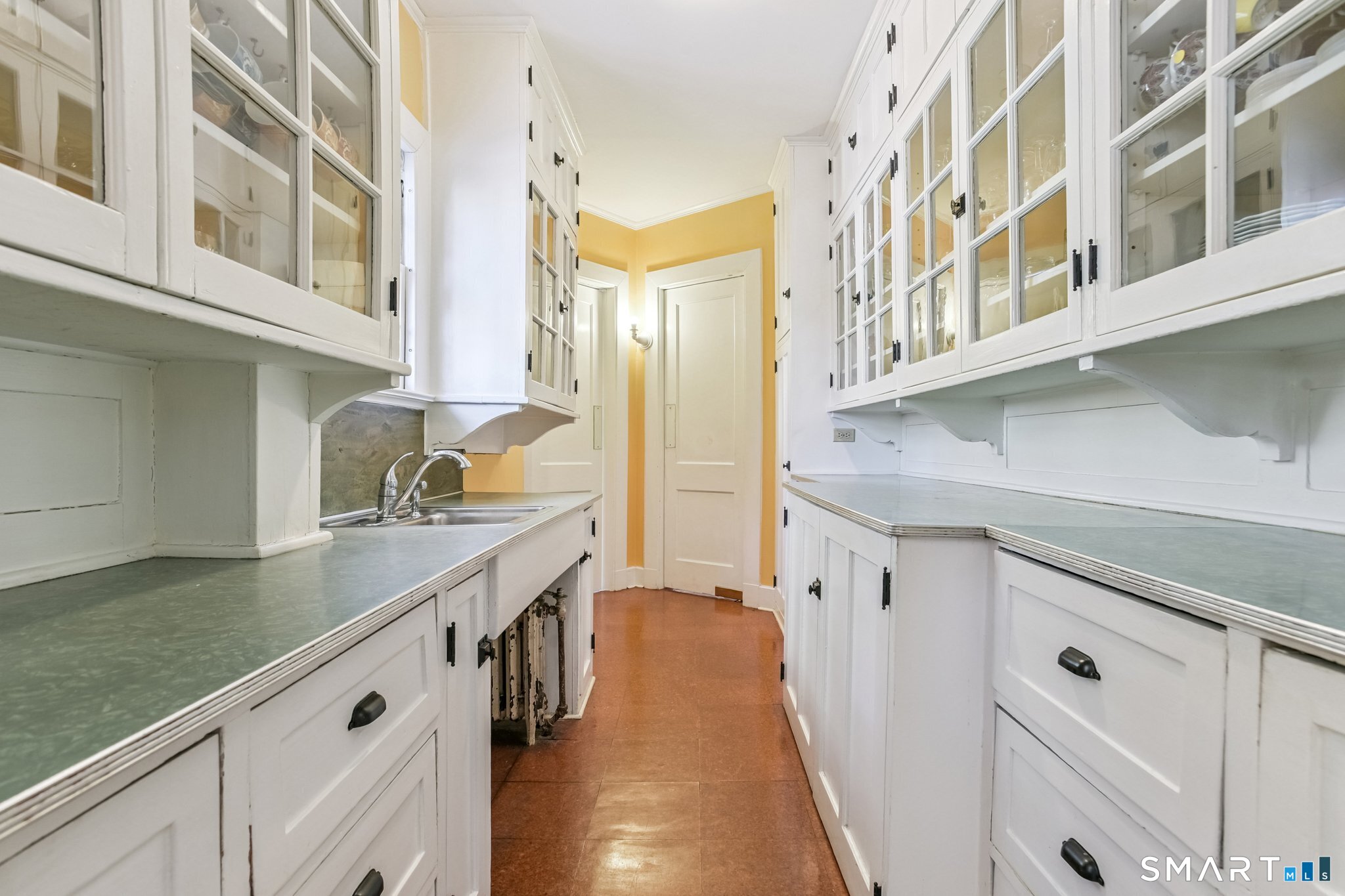 1050 Whitney Avenue Hamden, CT 06517 - Photo 24 of 40 a kitchen with stainless steel appliances granite countertop a lot of counter space and wooden floors