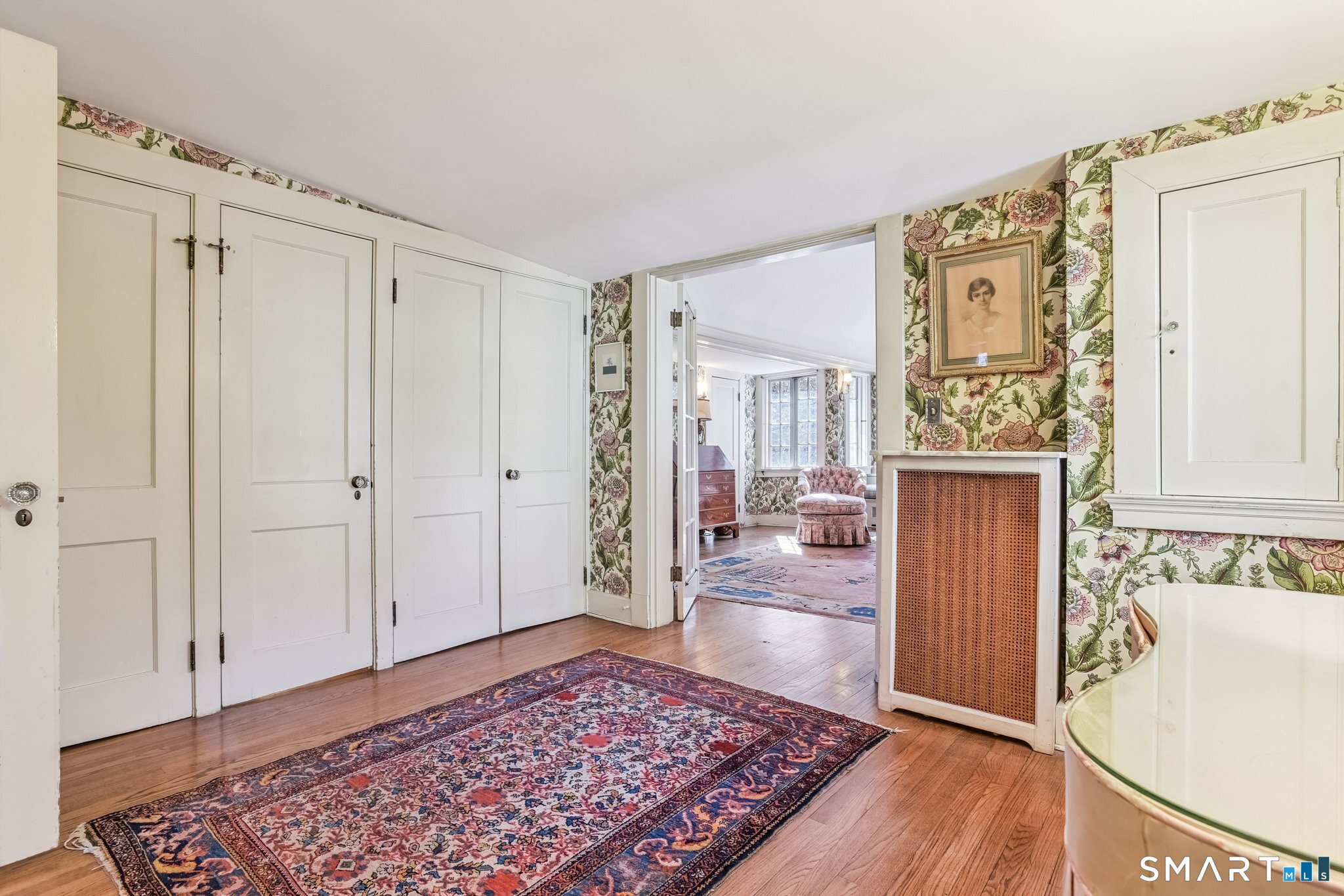 1050 Whitney Avenue Hamden, CT 06517 - Photo 28 of 40 a view of a hallway with wooden floor and cabinet
