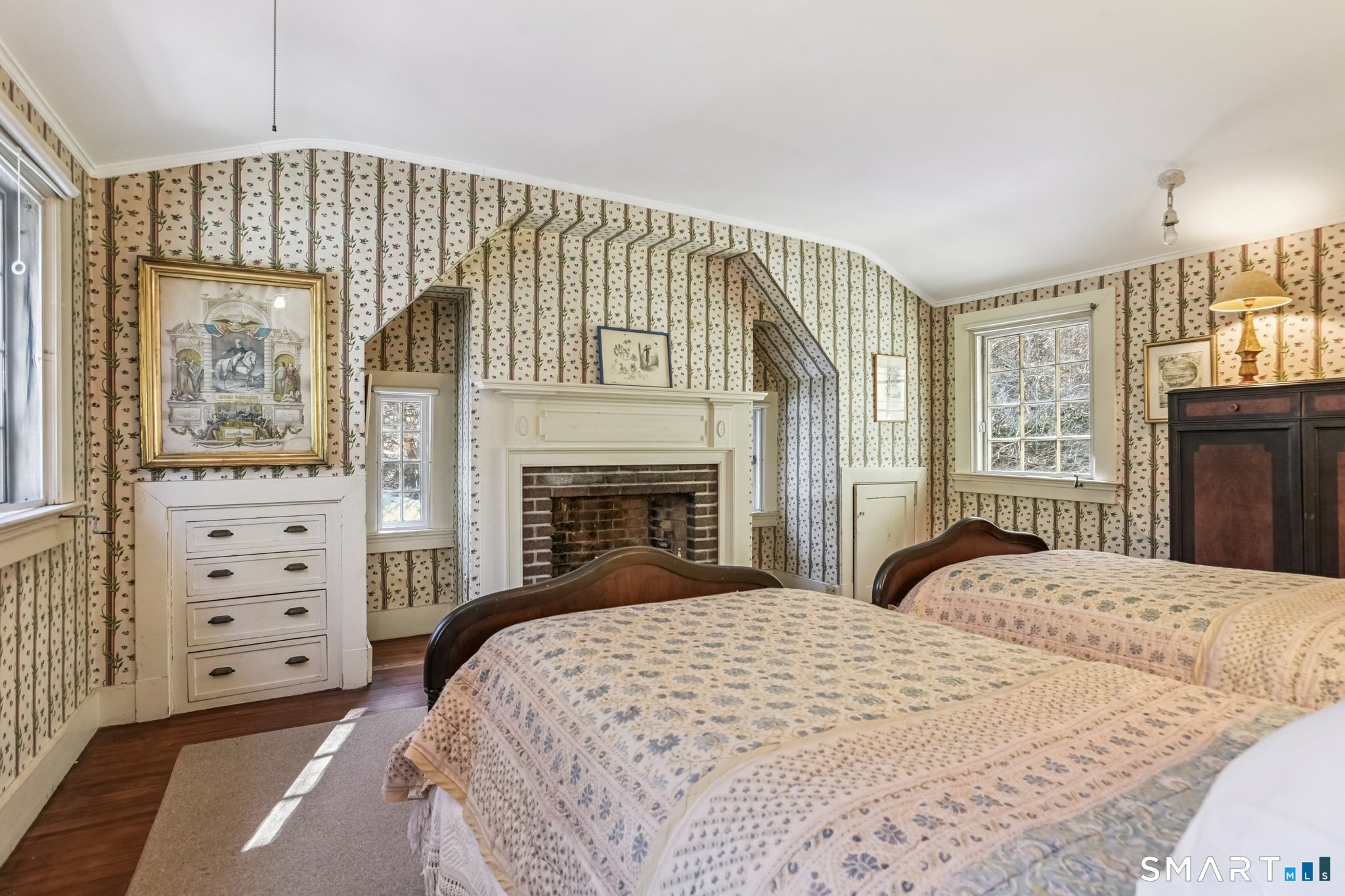 1050 Whitney Avenue Hamden, CT 06517 - Photo 32 of 40 a bedroom with a bed and dresser with mirror
