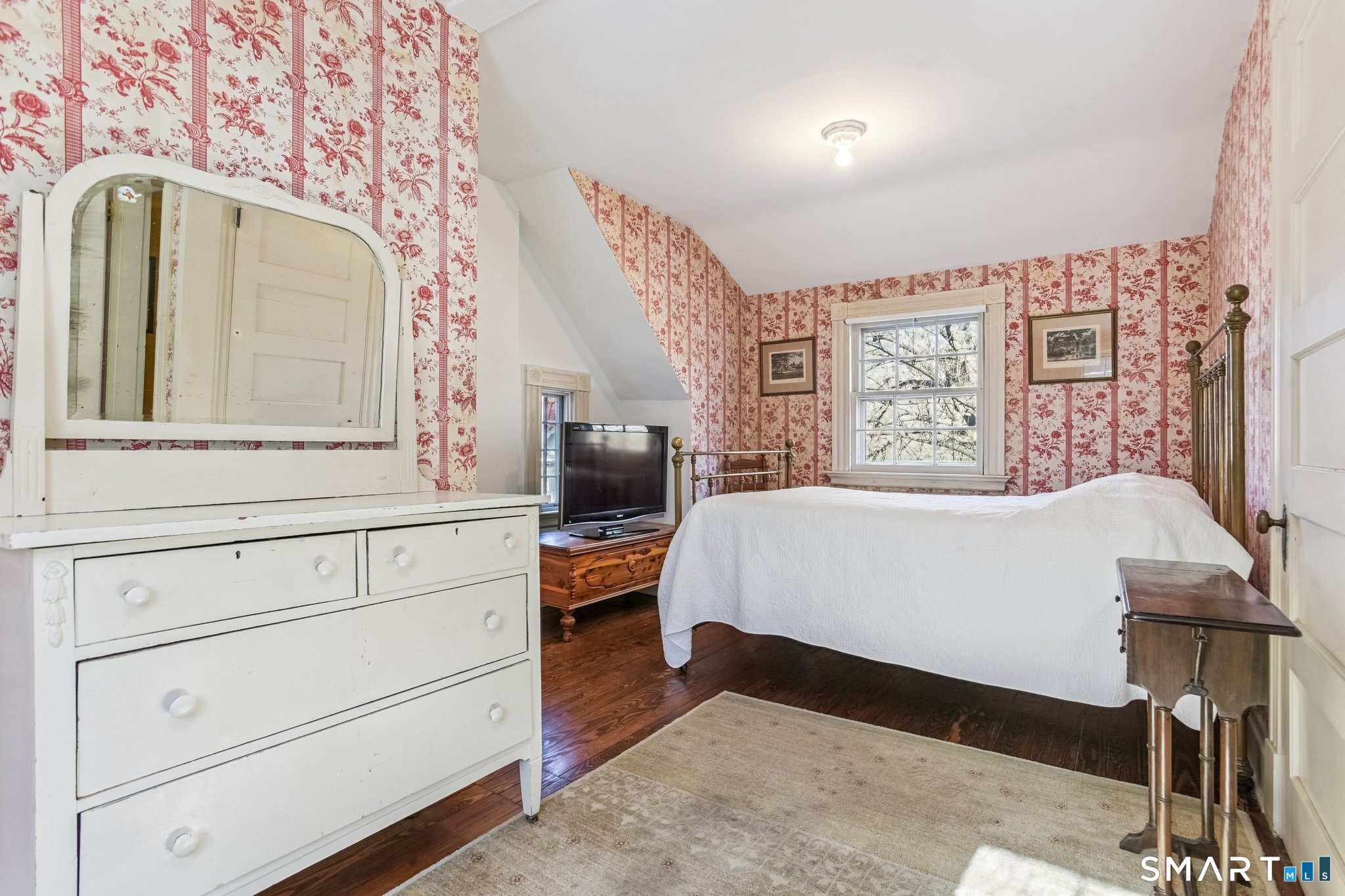 1050 Whitney Avenue Hamden, CT 06517 - Photo 34 of 40 a bedroom with a bed a dresser and potted plants on the dresser