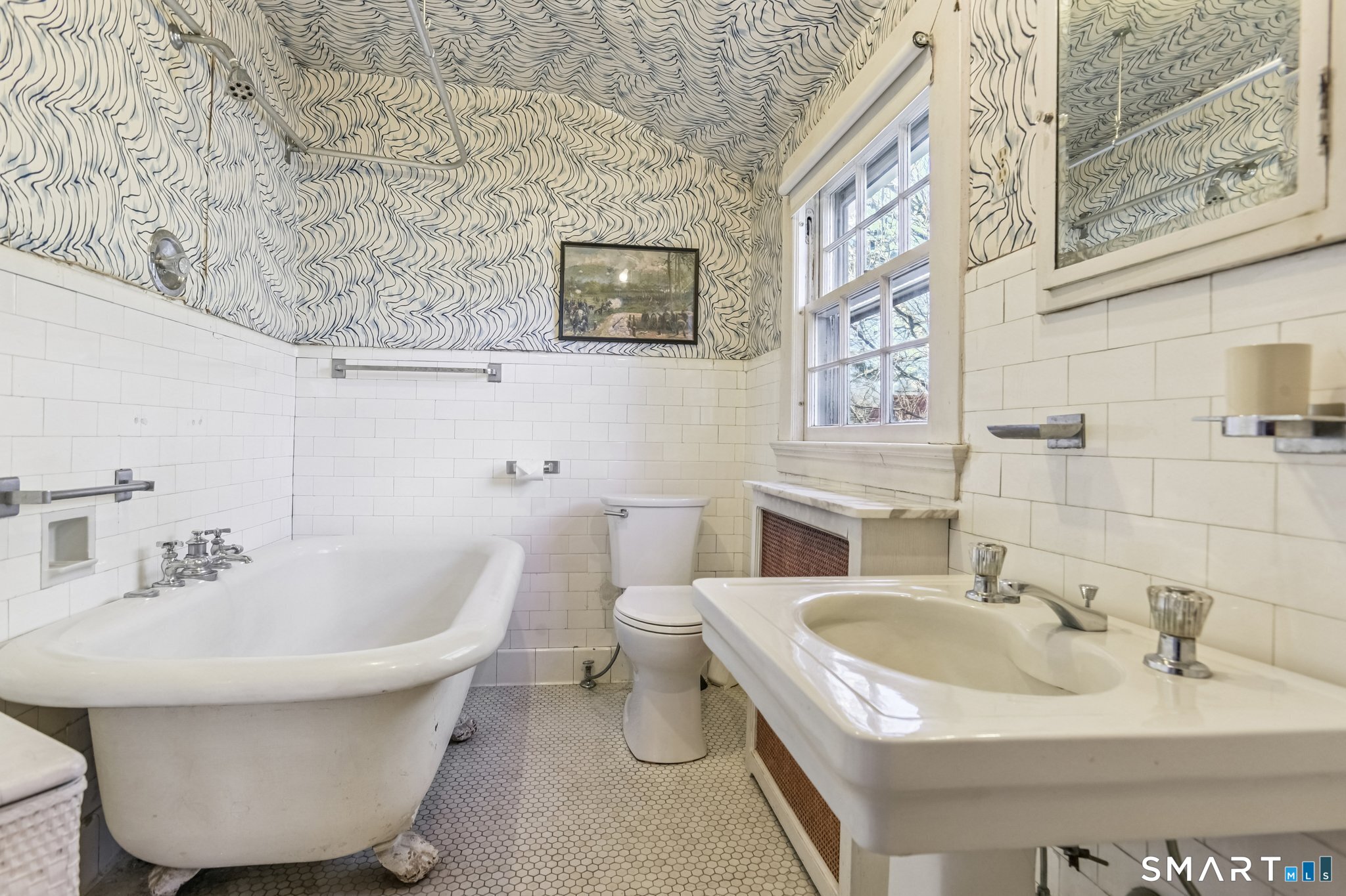 1050 Whitney Avenue Hamden, CT 06517 - Photo 37 of 40 a bathroom with a toilet sink and mirror